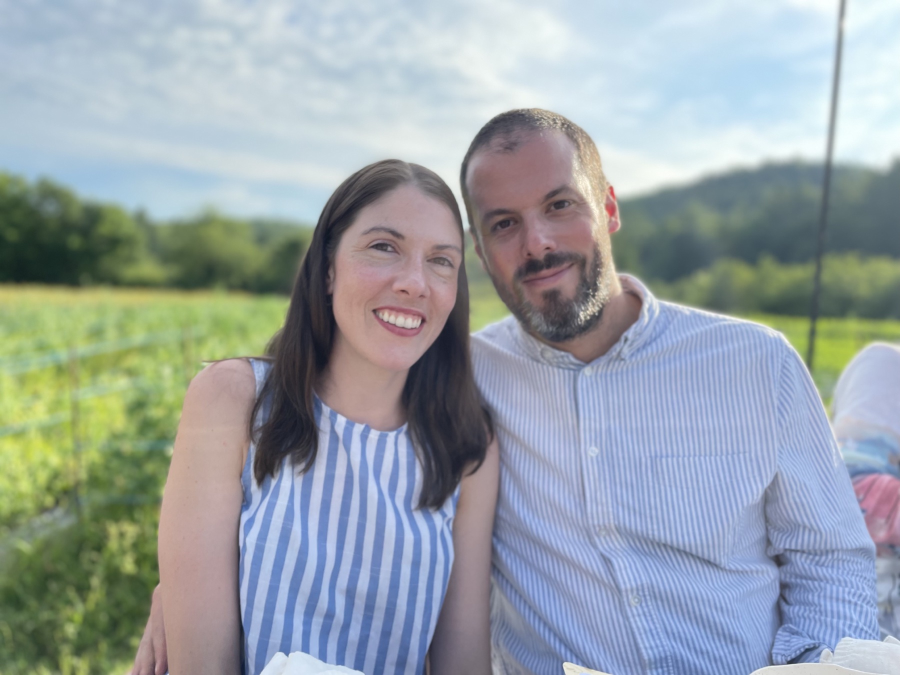 Lawrence and his wife smiling together outdoors